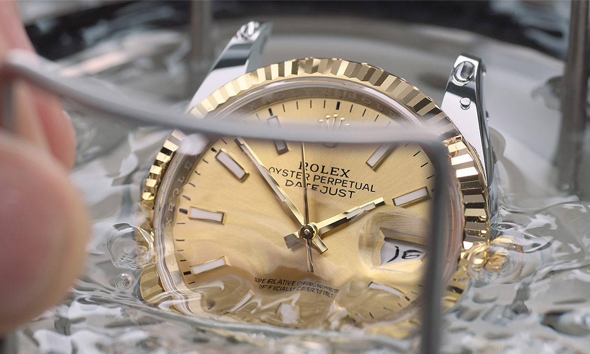 A Rolex watch being waterproofness tested