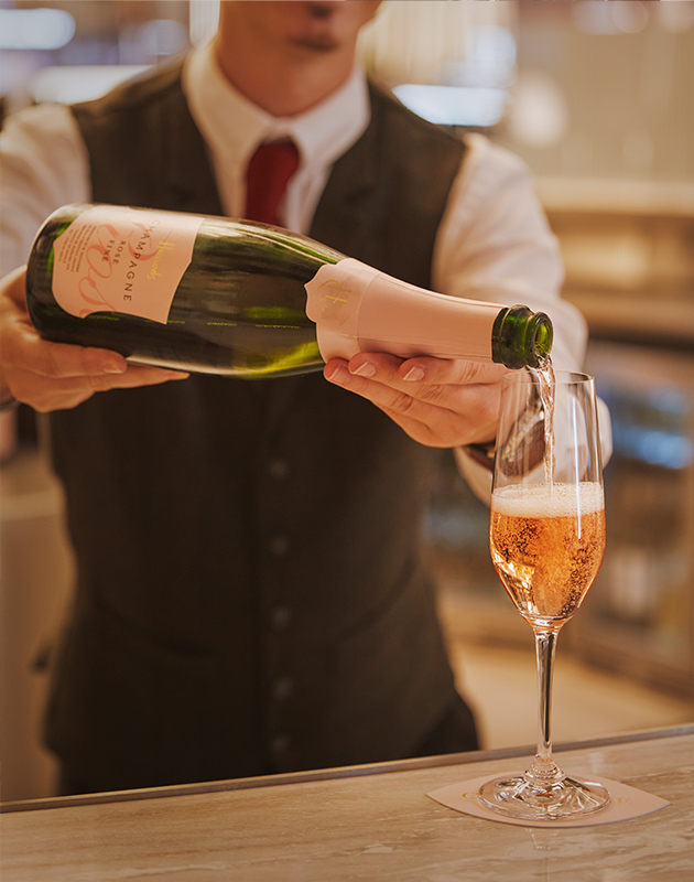 Harrods Champagne being poured at The Harrods Champagne Bar inside the H beauty store