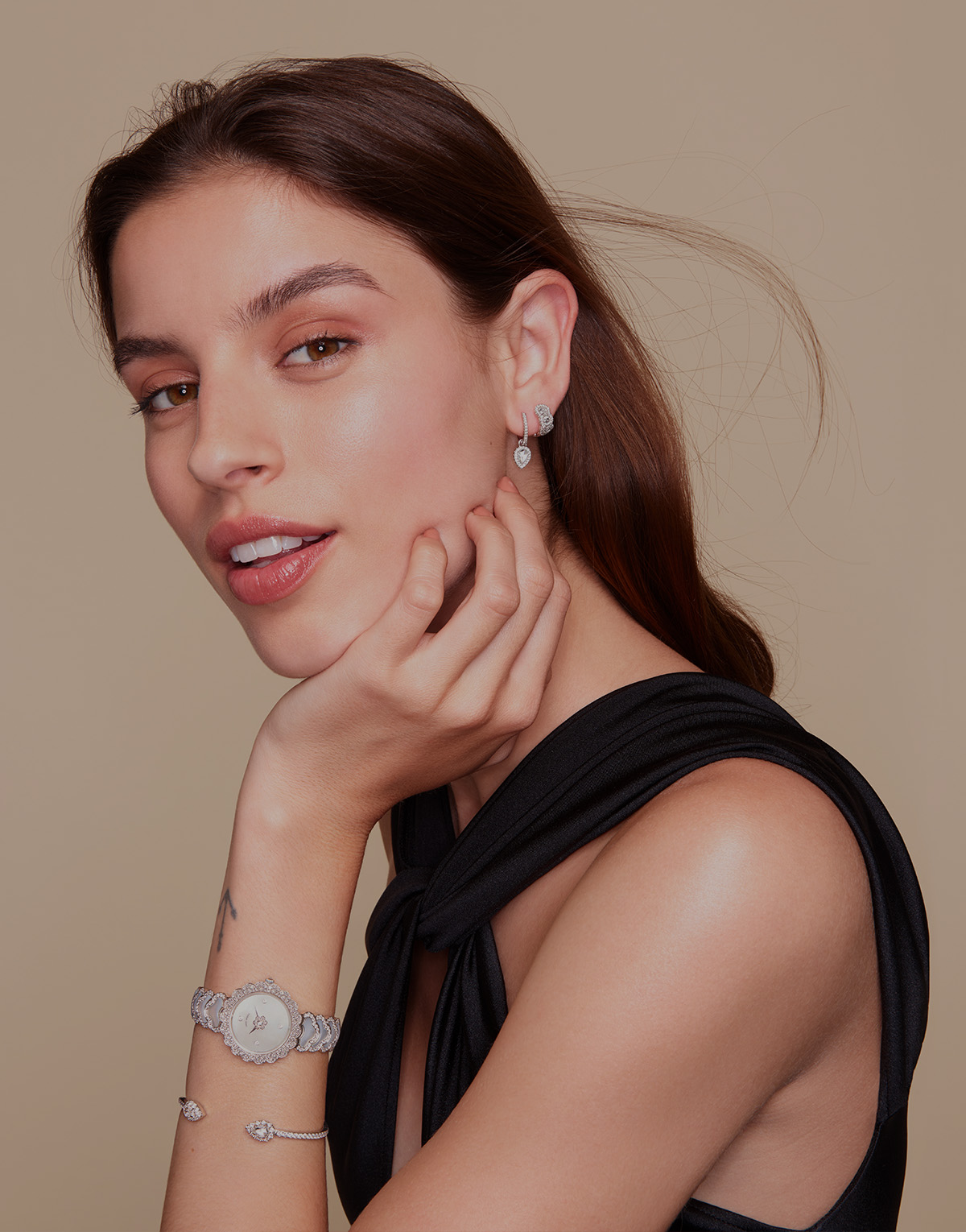 Woman wearing David Morris Fine Jewellery rings and earrings