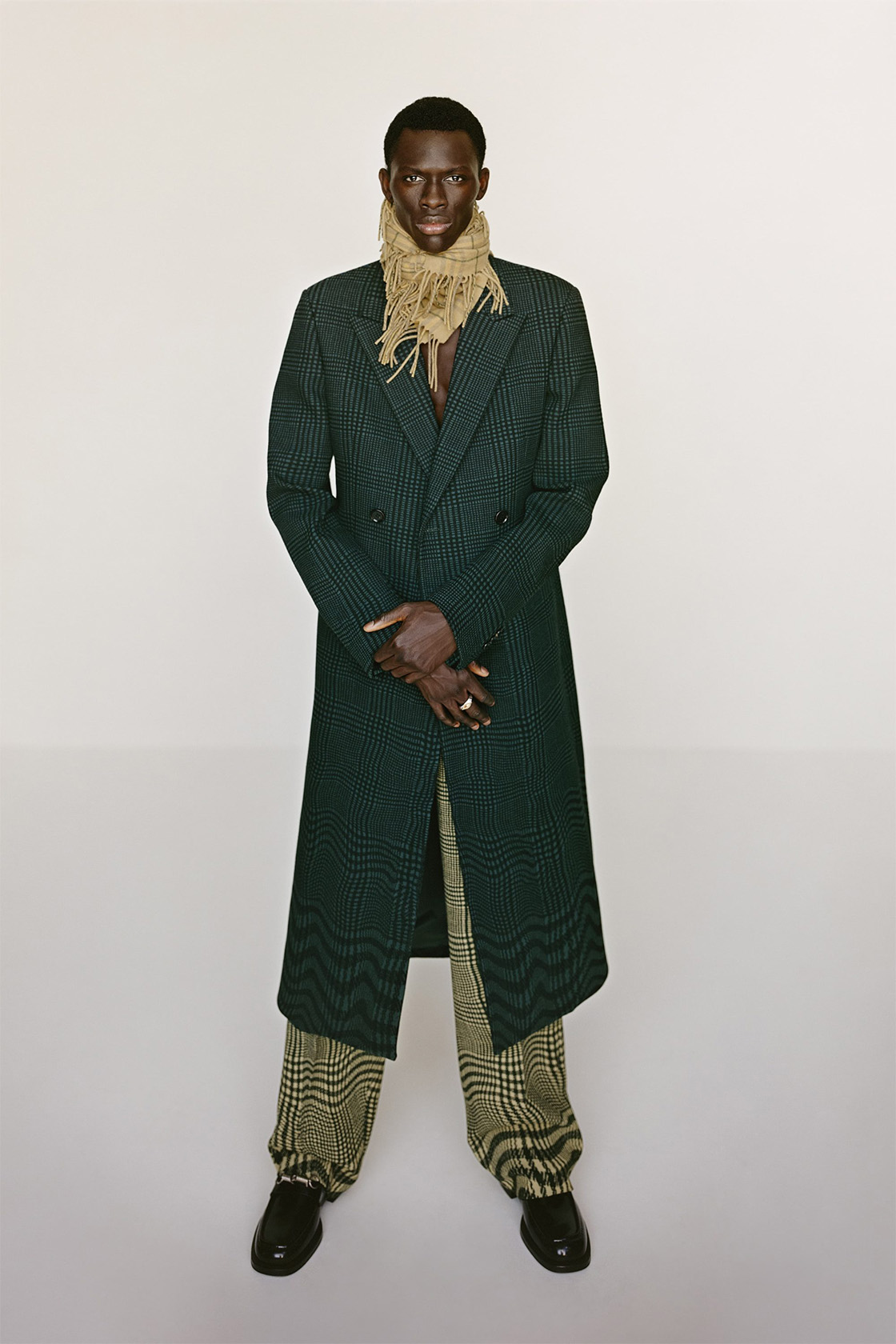 Male model wears seasonal green Burberry outfit