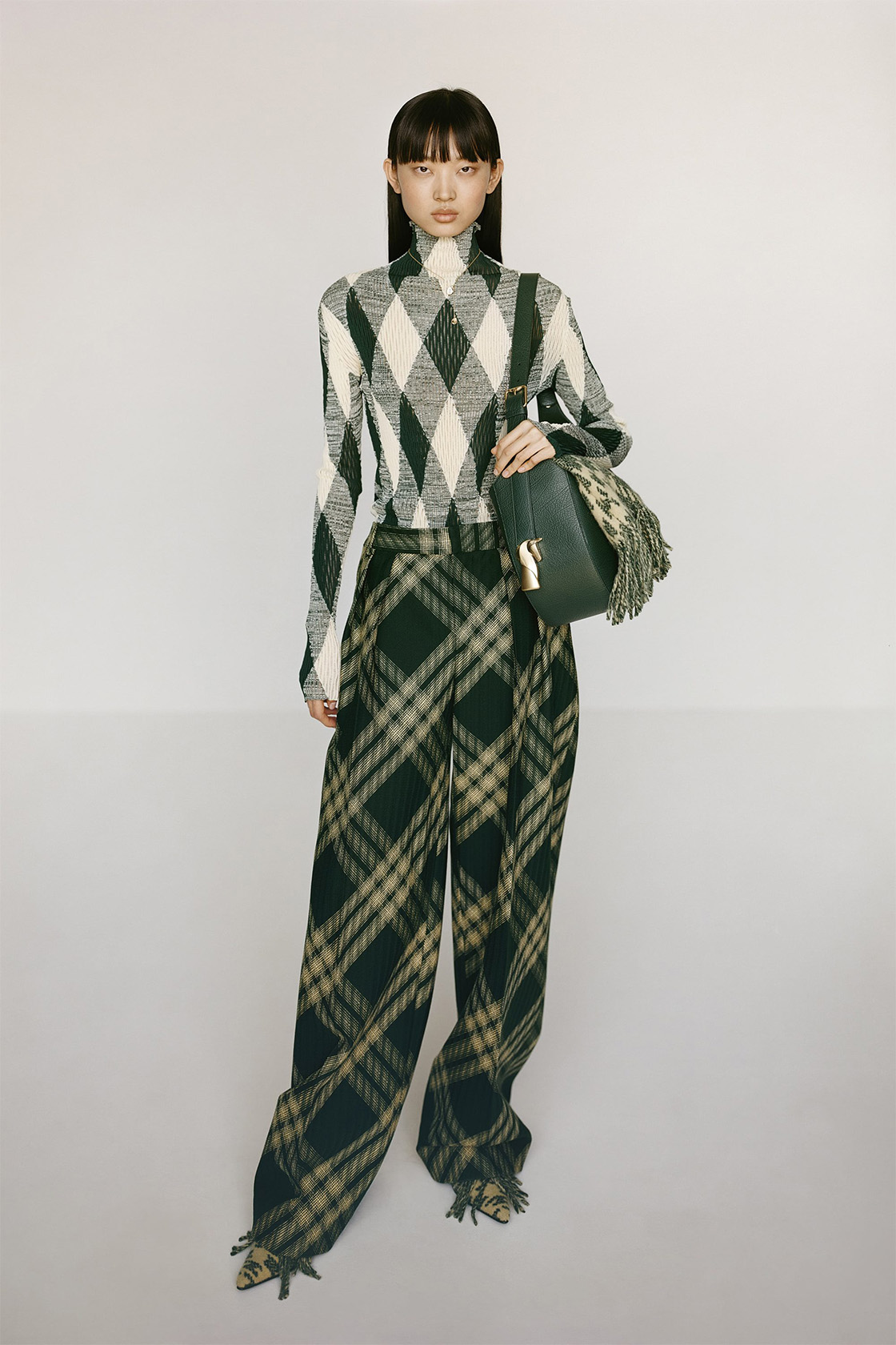 Female model wears seasonal green Burberry check outfit