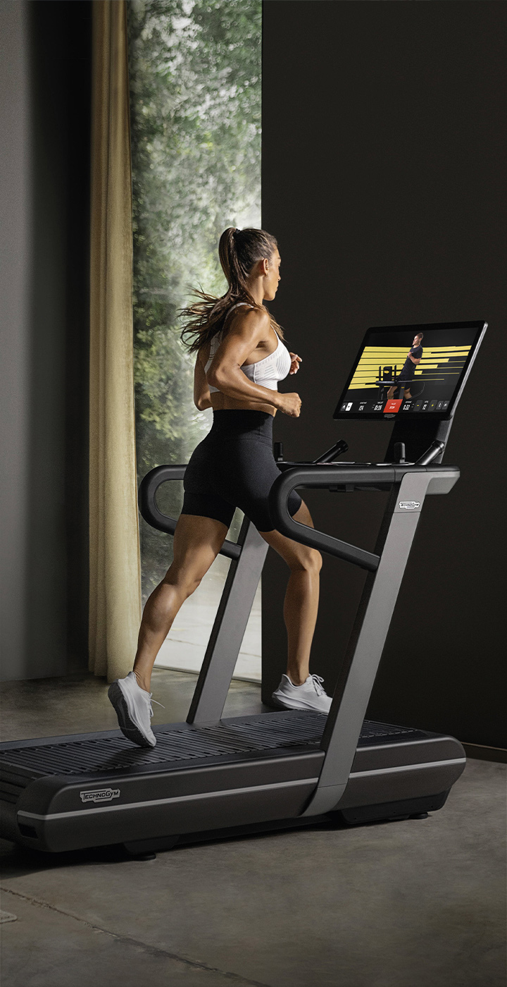 Man riding a technogym bike