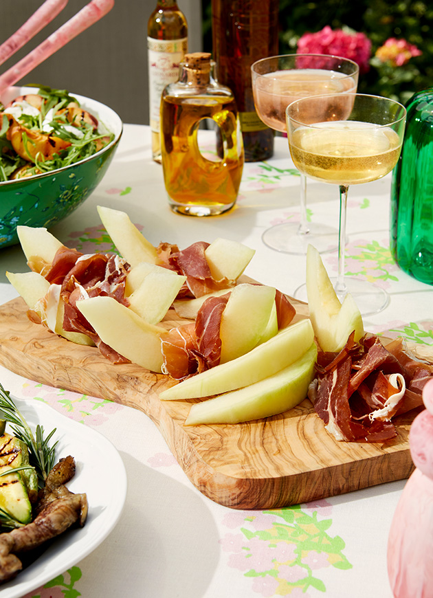 Melon and parma ham on a side plate with Champagne