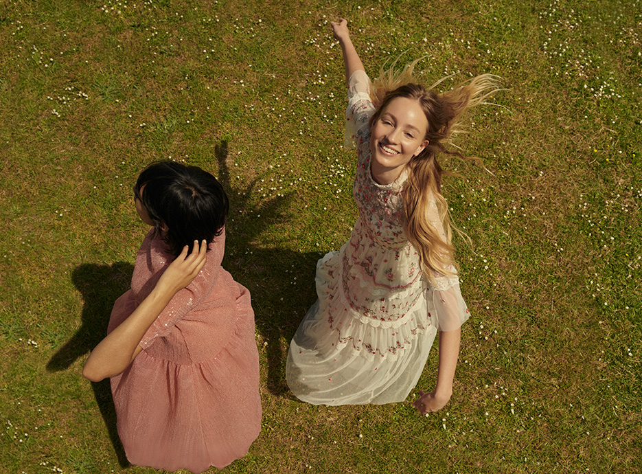 Rose and Ameera dancing in pink Huishan Zhang and floral Needle & Thread summer dresses