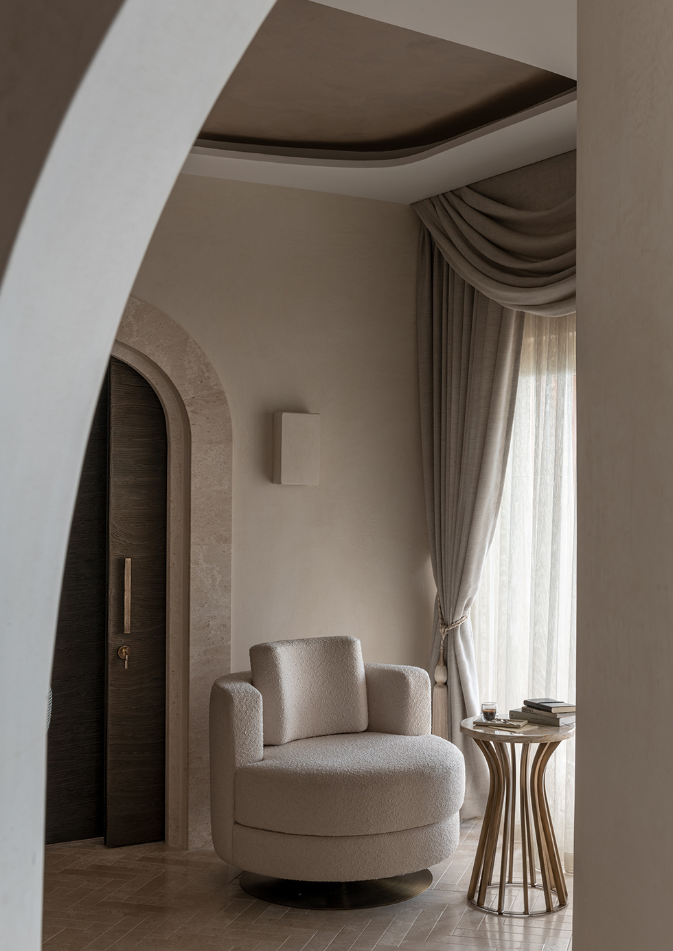 Hotel Cala Di Volpe interior with armchair and coffee table