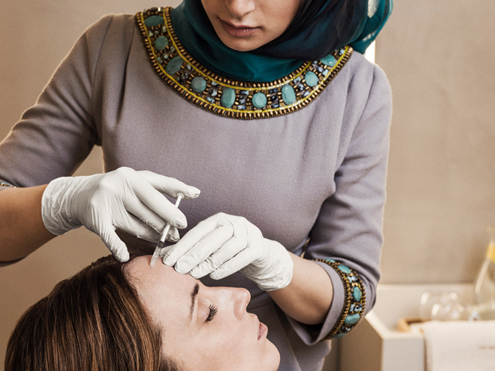 Dr Marwa Ali performing a procedure on a client