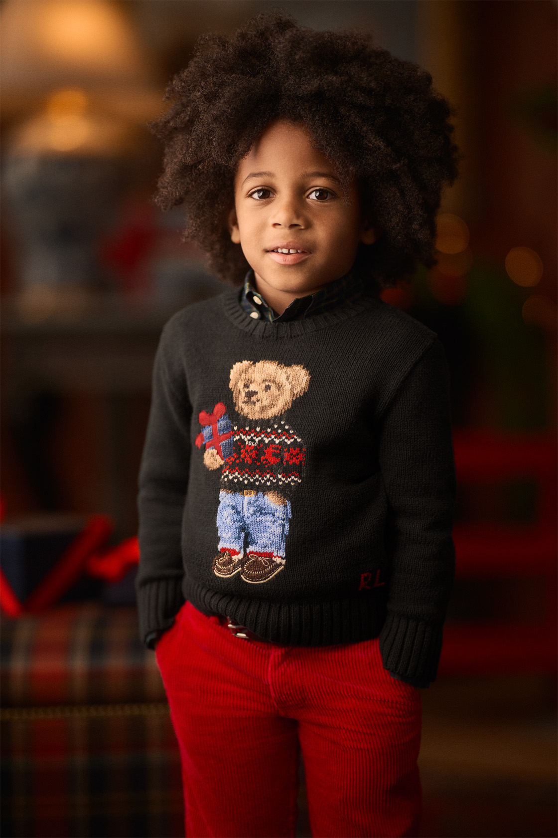 Boy wearing a Ralph Lauren Christmas jumper