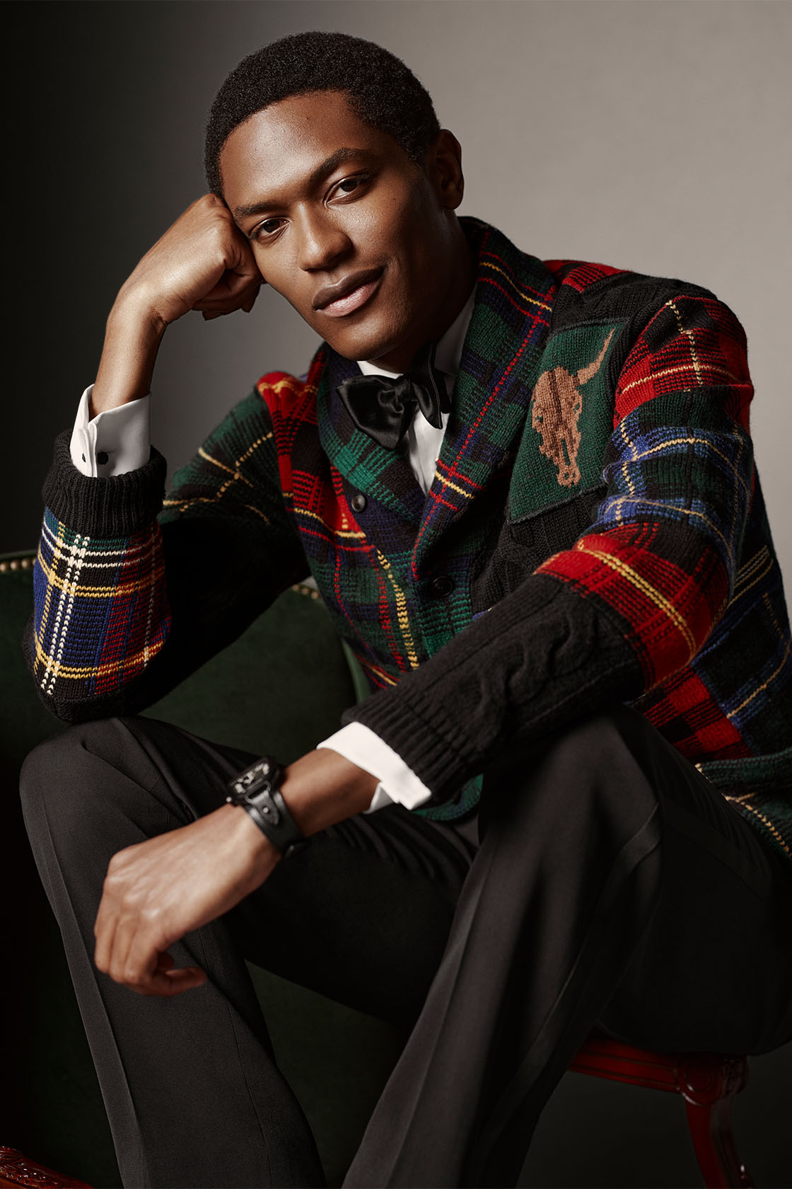 Man smiling in a Ralph Lauren tartan dinner jacket