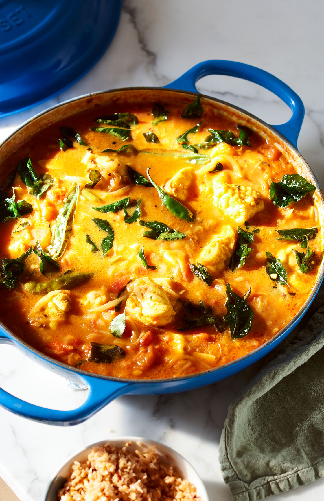 Lankan style fish and tomato curry, served with a coconut sambal