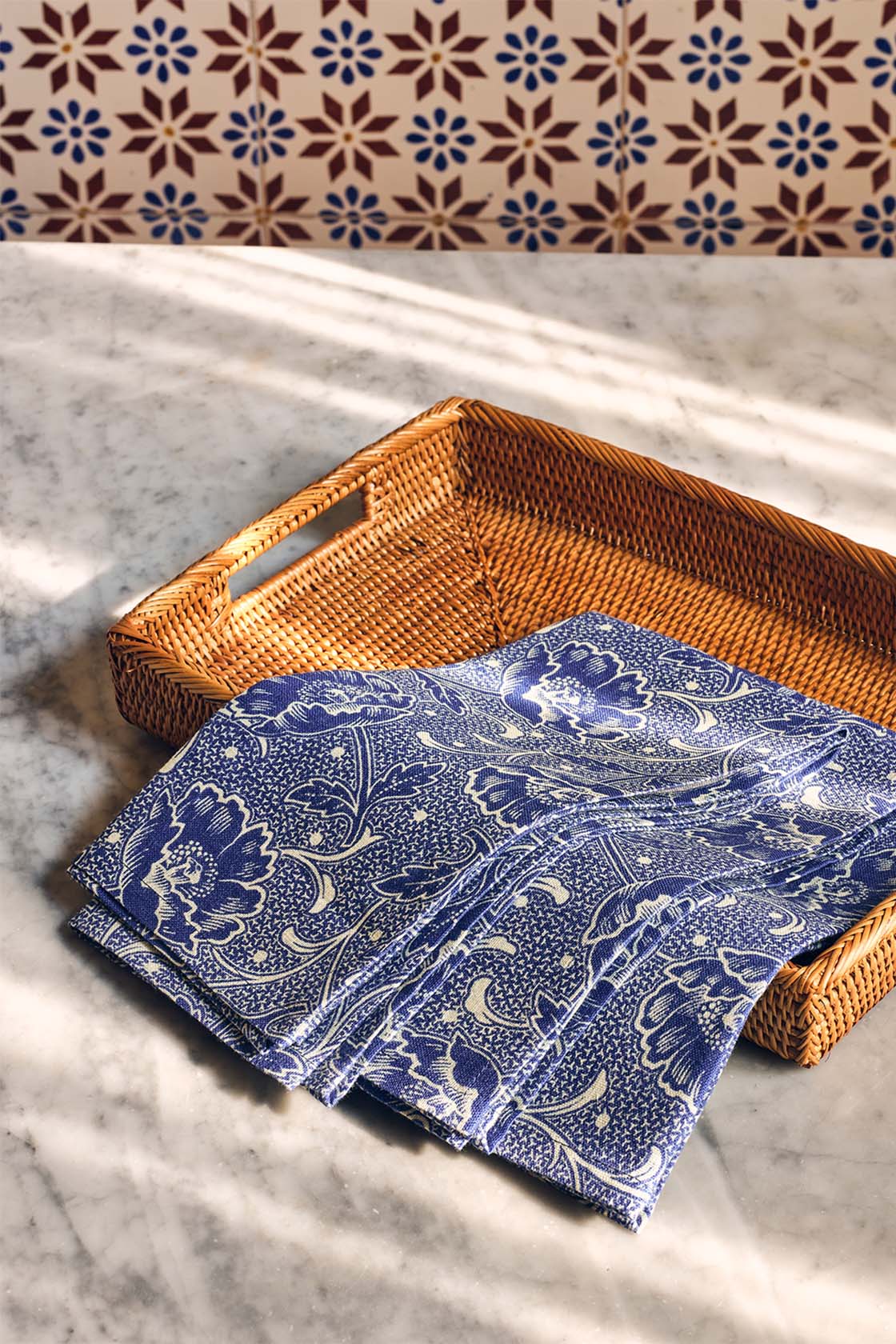 Blue napkins folded on a wooden table upon a table