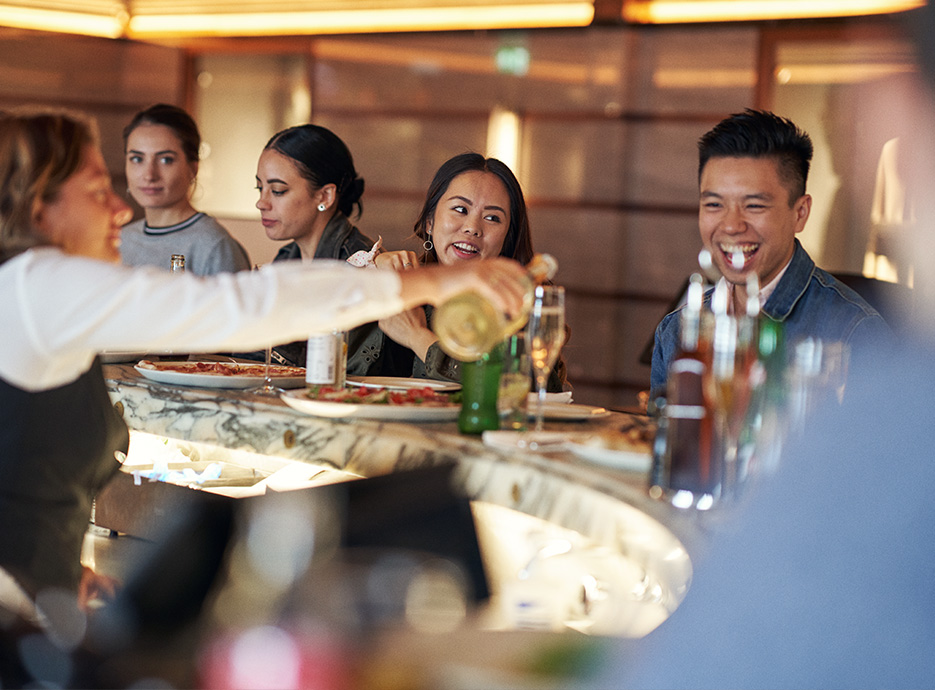 Harrods Restaurants - Pizzeria - Customers enjoying pizza