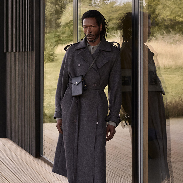 Male model wearing long trench coat