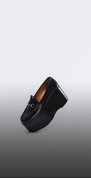 Gucci black loafers with gold hardware