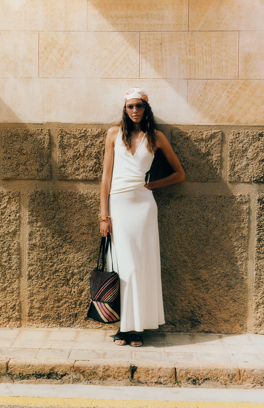 Female model wearing white Christopher Esber summer dress