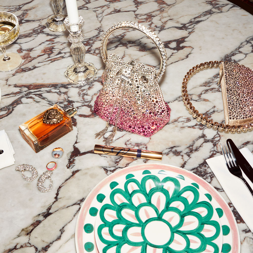 Glittery ombré pink and white crystal handbag on party table