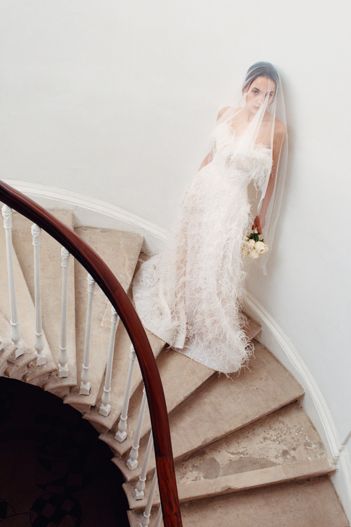 Woman wearing a white wedding dress and veil