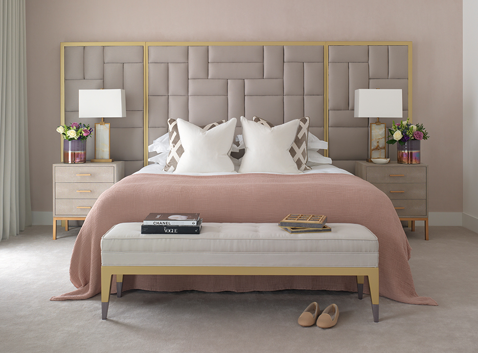 Bedroom with large grey and gold headboard