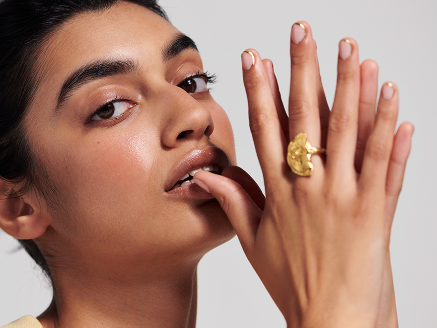 Woman showing her nails that have been painted at Townhouse Nails