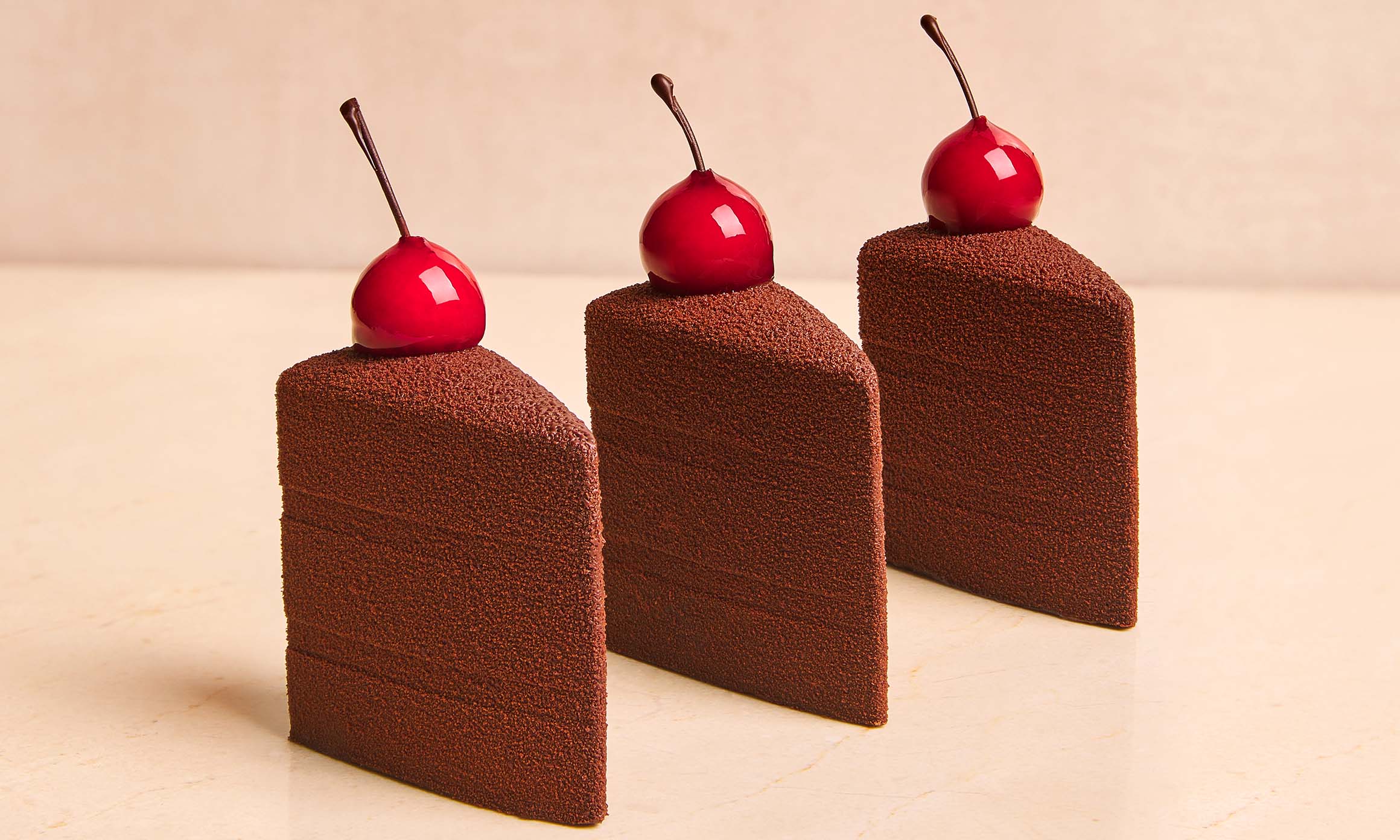 Chocolate cake with a red cherry on top