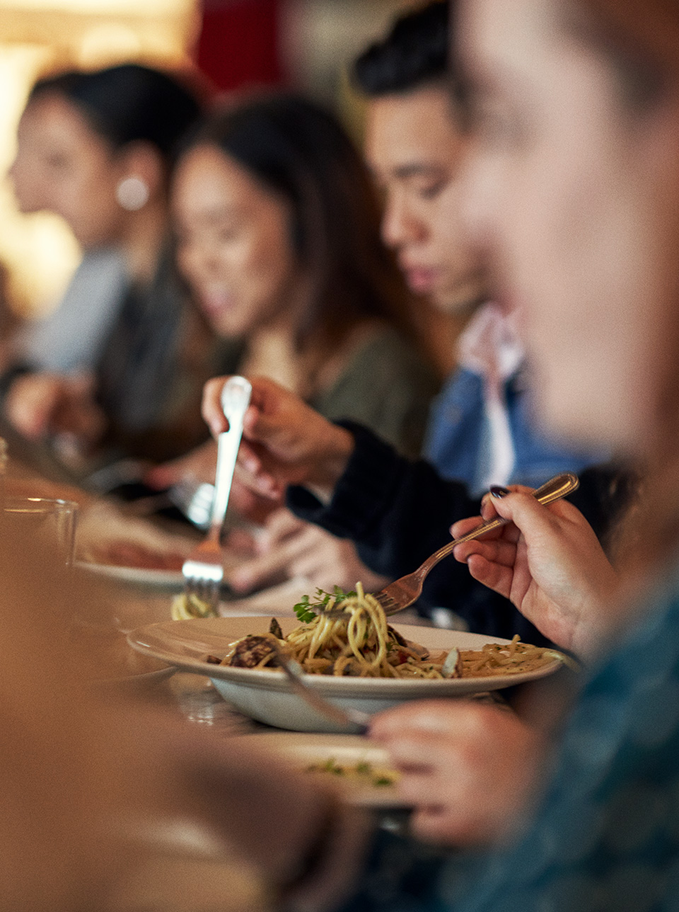 Harrods Restaurants - The Pizzeria - Customers eating pasta at the bar