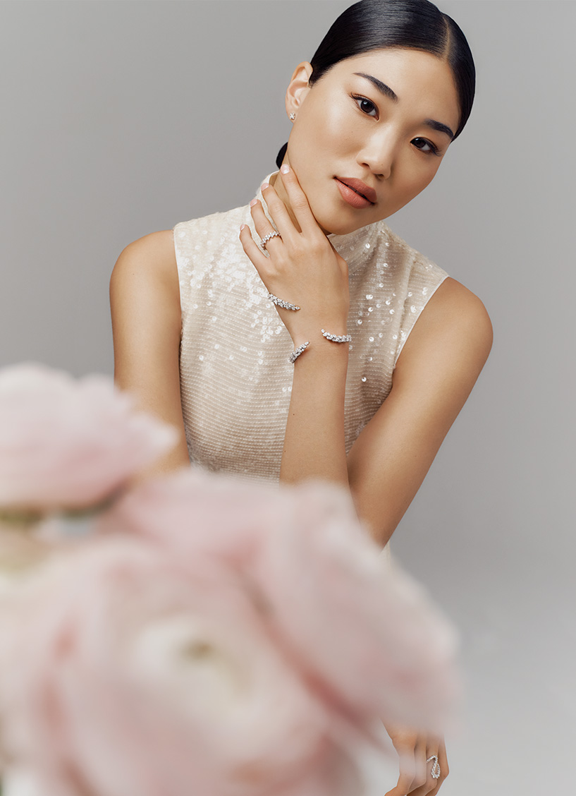 A model wears a diamond bracelet by Yeprem and a LaPointe cream sequin dress