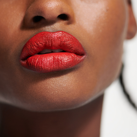 Close up detail of woman's red lips