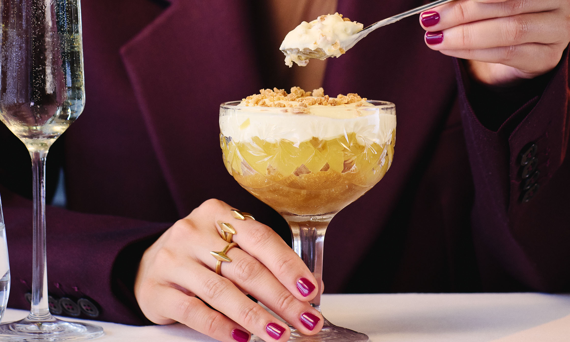 Woman eating a dessert in a glass