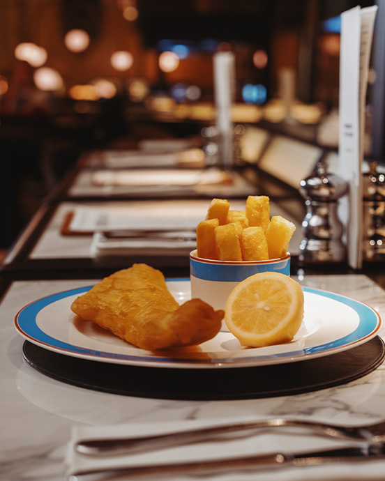 Haddock fish and chips with sauces and side salad