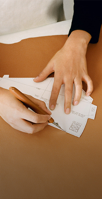 Artisan making a leather bag