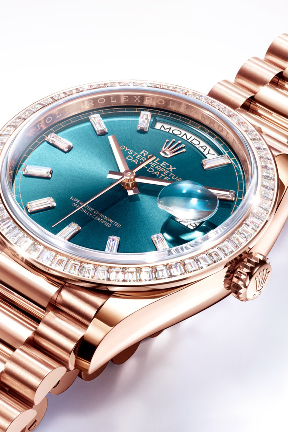 Rolex Day-Date rose gold watch with blue-green dial and diamond bezel