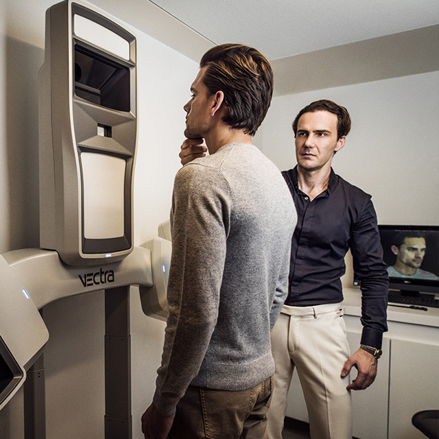 Dr Costas performing a full body scan on a male client for Body Remodelling in the Wellness Clinic at Harrods